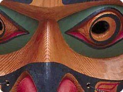 Detail of mask, showing black, red-brown, and green